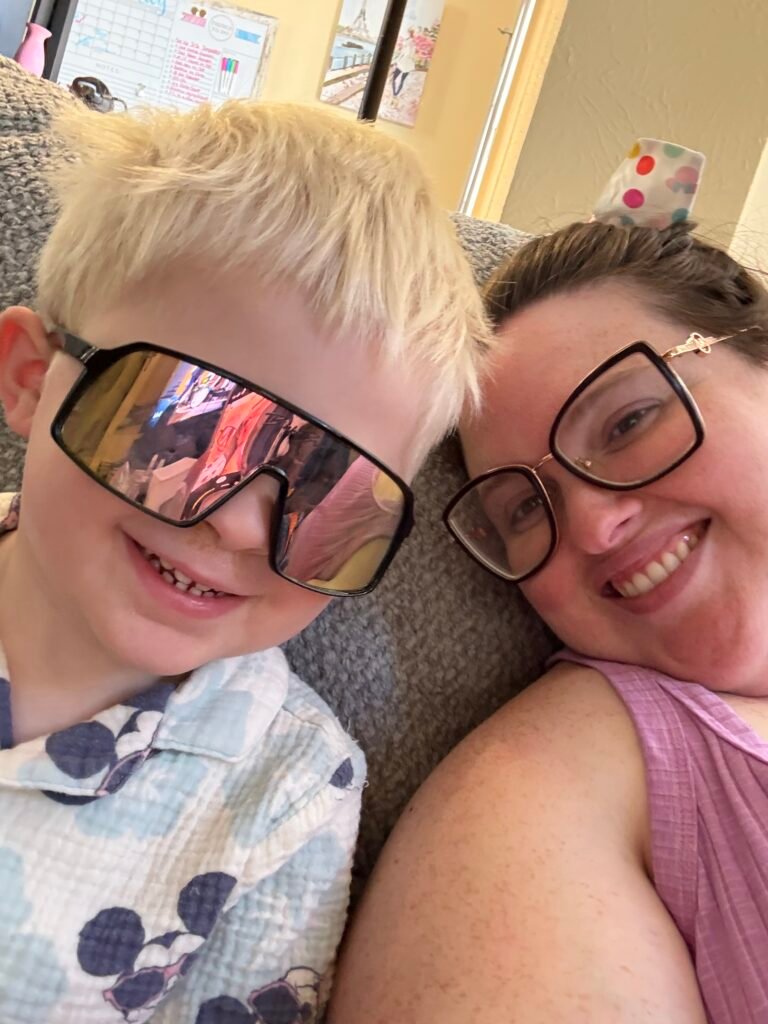 Megan sharing a playful moment with her young son at home.